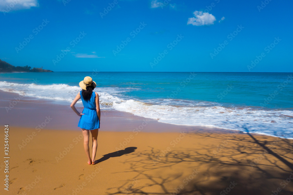 Girl in blue dress at Caribbean beach, Guadeloupe Girl in blue dress at Caribbean beach, Guadeloupe