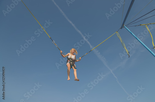 child jumping in the jumping attraction