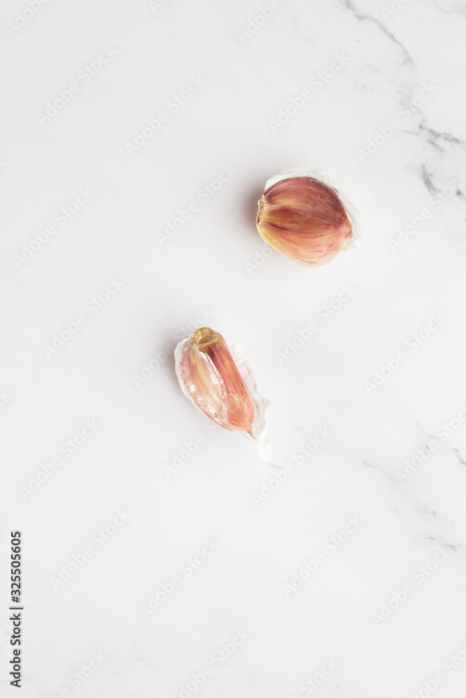 Aromatic white garlic cloves isolated on white background. Macro Photo food garlic. Background texture. Plant vegetable garlic. Cooking, spices and kitchen concept.