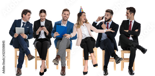 6 happy businessmen celebrating birthday and holding their phones