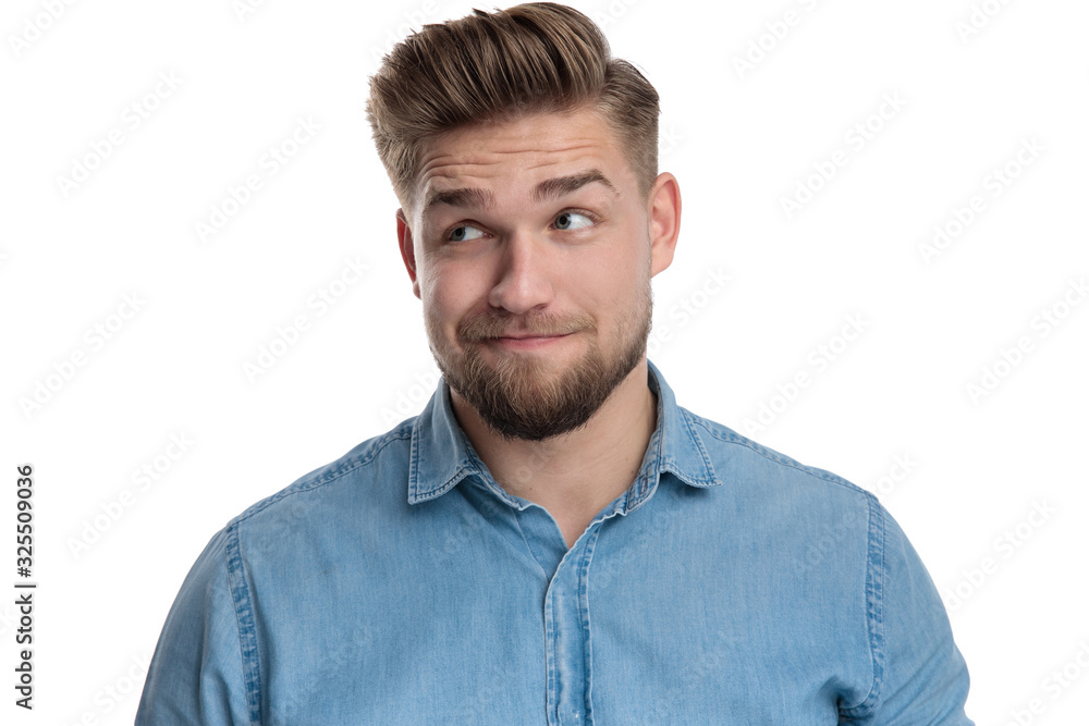 Handsome casual man thinking and looking away Handsome casual man thinking and looking away
