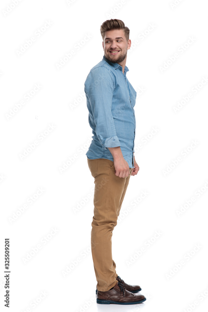 Side view of a cheerful casual man laughing Side view of a cheerful casual man laughing