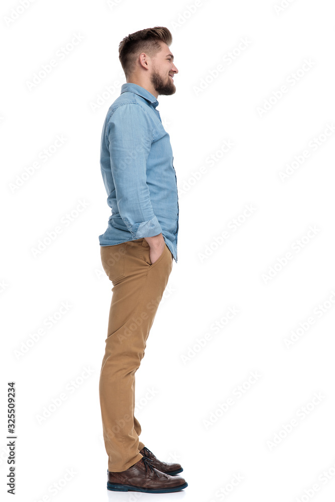 Side view of a positive casual man standing Side view of a positive casual man standing