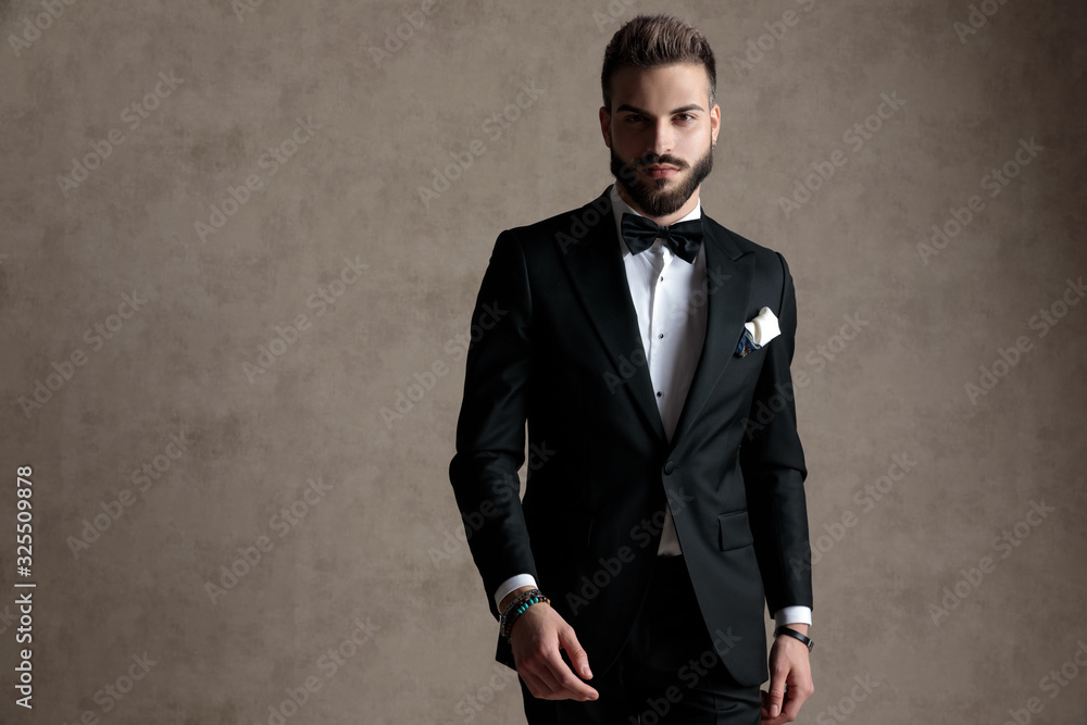 Young groom looking forward seriously Young groom looking forward seriously