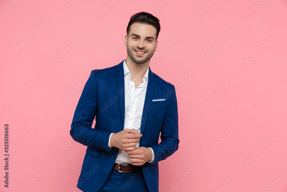 Cheerful businessman laughing while wearing blue suit