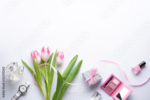 Fototapeta Naklejka Na Ścianę i Meble -  Composition with pink tulips on a white background with space for text, top view. 8 March, International Women's Day.  Valentine's Day.