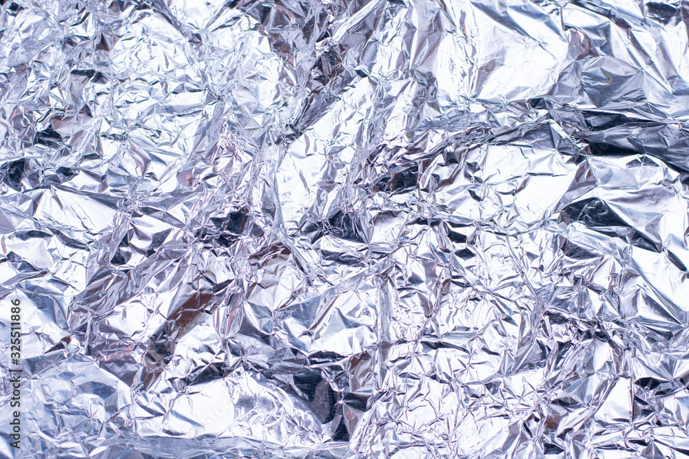 Silver foil with shiny surface for background Silver foil with shiny surface for background