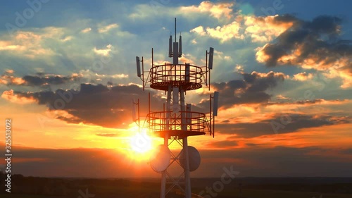 Aerial view of the top of telecommunication tower. Its antennas designed for transmitting cellular mobile signals covering large areas providing high speed 4g and modern 5g traffic network service.