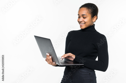 Latin woman holding a laptop - isolated over a white background