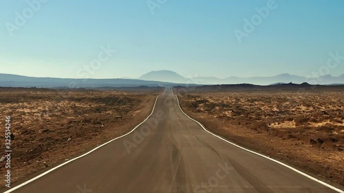 Driving POV in solitude on a breathtaking Arizona asphalt desert highway travel landscape road