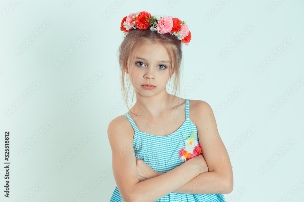 Cranky girl looking at camera with arms crossed, folded hands Cranky girl looking at camera with arms crossed, folded hands