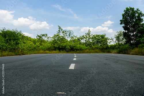 A road to nowhere in the Malaysian rainforest. The street was build but the destination didn't exist, construction of the road stopes suddenly and the road ends in the jungle of Putrajaya, Malaysia.