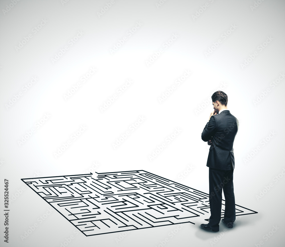 Businessman looking at labyrinth. Businessman looking at labyrinth.