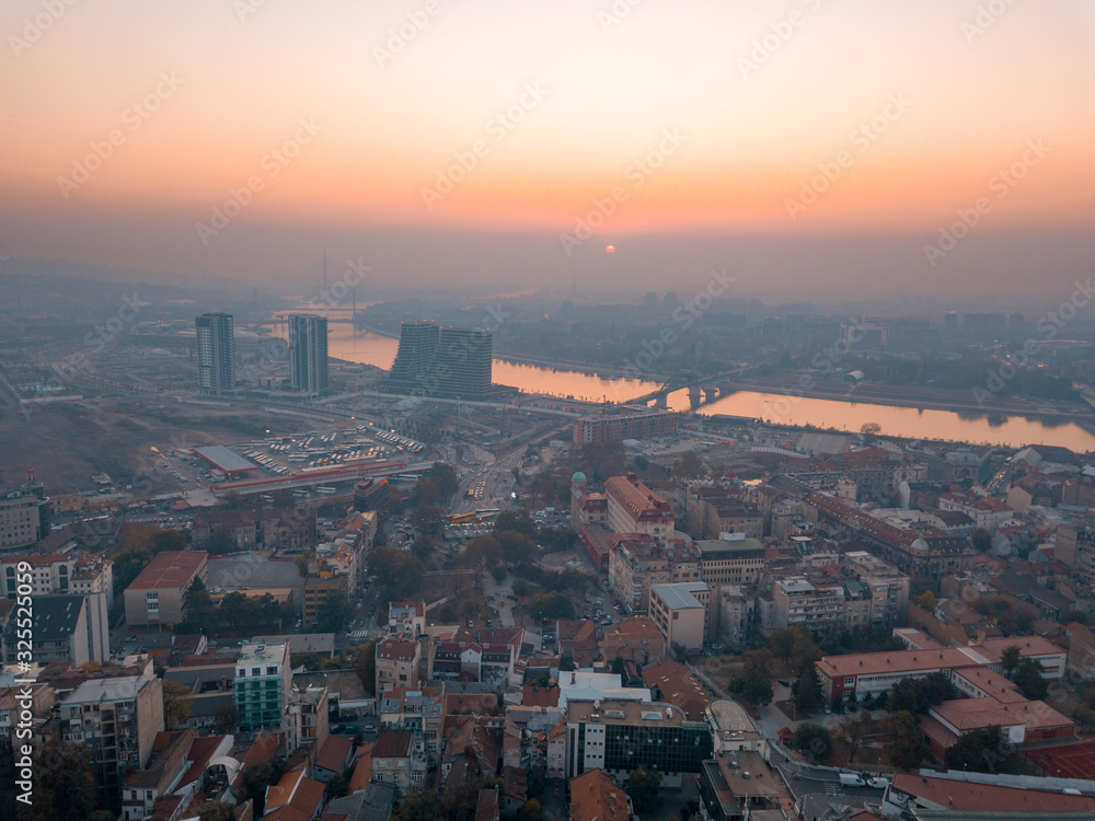 Drone view of Sava river, bridges and thick smog over Belgrade