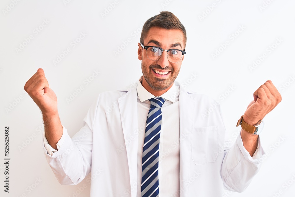 Young handsome therapist man over isolated background celebrating surprised and amazed for success with arms raised and open eyes. Winner concept. Young handsome therapist man over isolated background celebrating surprised and amazed for success with arms raised and open eyes. Winner concept.