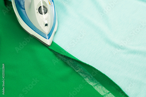 Hemming, shortening a green courtain fabric with an iron and the iron-on adhesive hemming tape - quick way to fix fabrics and clothes with no sewing