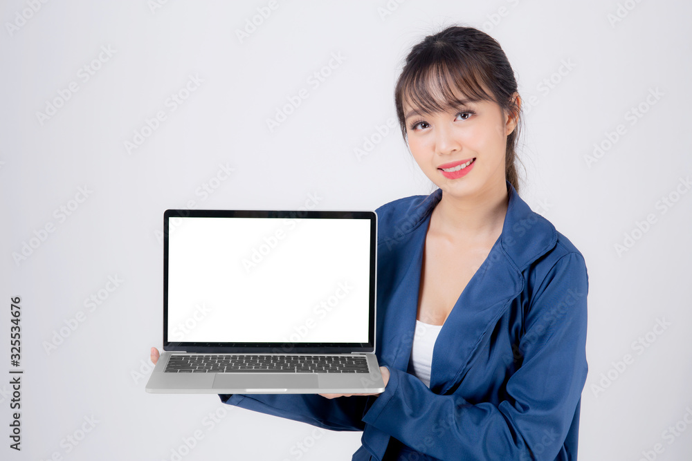 Beautiful young asian business woman happy holding and presenting laptop computer blank screen isolated on white background, businesswoman confident showing notebook empty, advertising concept. Beautiful young asian business woman happy holding and presenting laptop computer blank screen isolated on white background, businesswoman confident showing notebook empty, advertising concept.