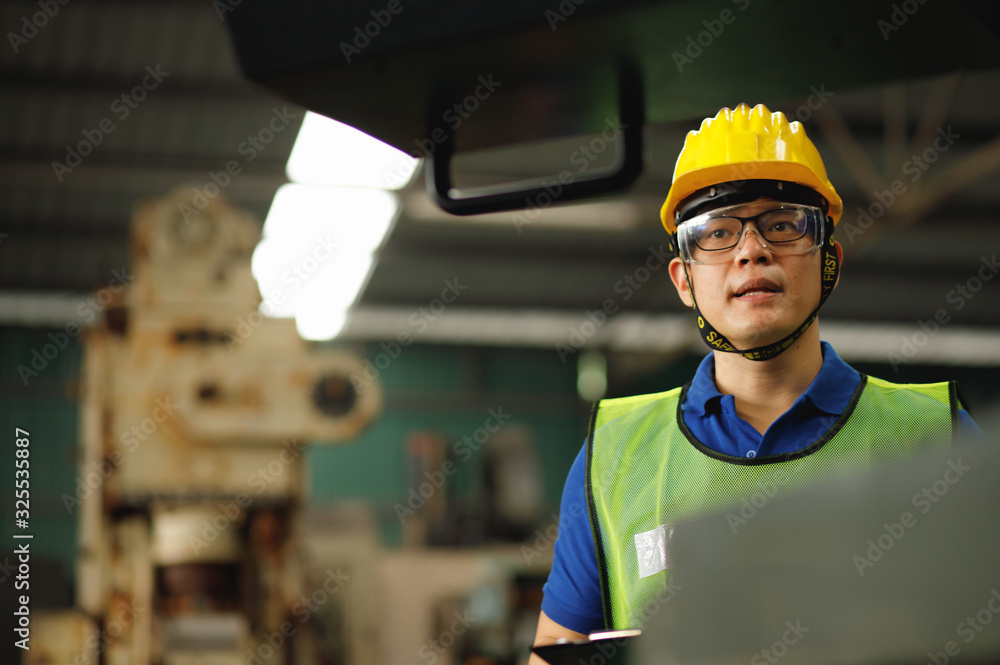 Professional asian worker. Engineers are saying explained how to control the staff. The engineering team looks stern about the machine settings in the factory. Professional asian worker. Engineers are saying explained how to control the staff. The engineering team looks stern about the machine settings in the factory.