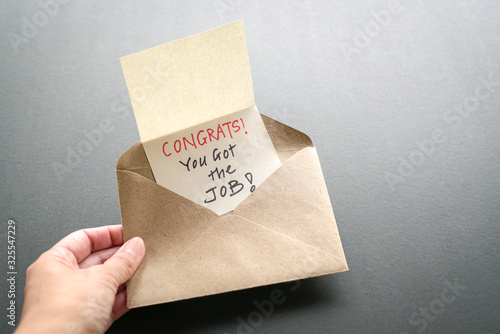 Congrats you got the job message in an envelope. Work or employment concept.
