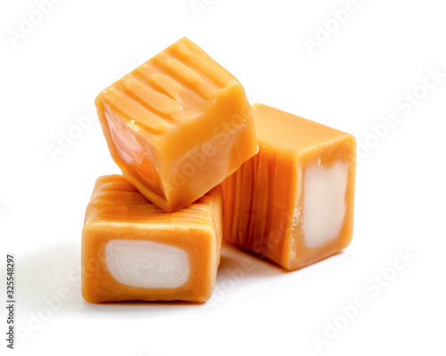 cream toffee caramel  group with   milk filling close-up isolated on white background