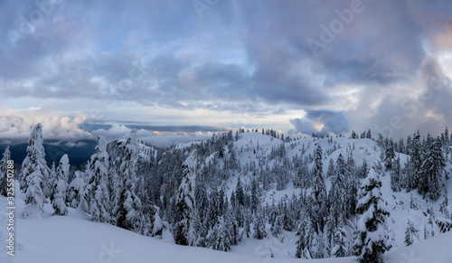 Canadian Nature Landscape covered in fresh white Snow during colorful winter sunset. Taken in Seymour Mountain, North Vancouver, British Columbia, Canada. Panorama