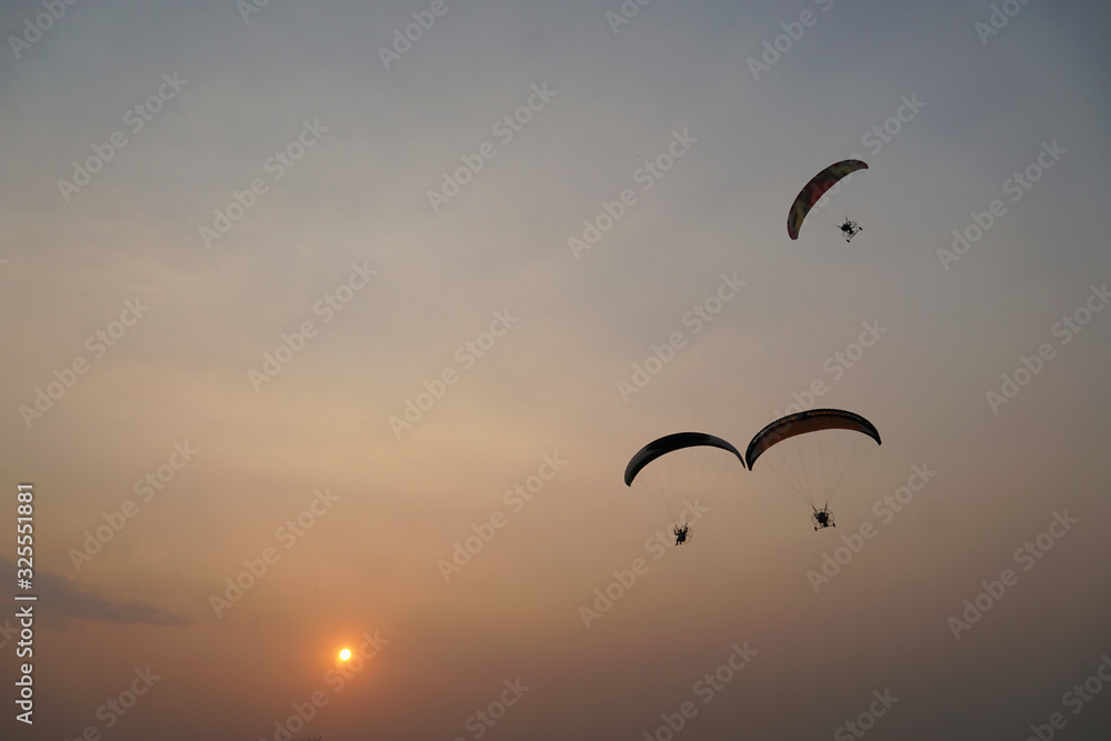 Silhouette Paramotor show with Sunset.