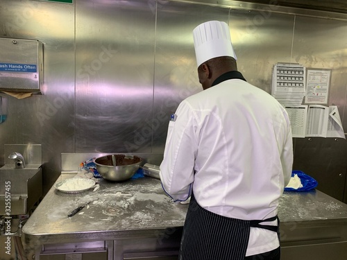 Konstfotografi Chef is cooking on a large cruise ship galley