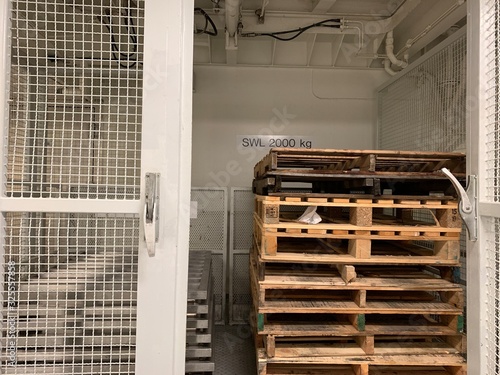 Wooden pallets inside service lift.