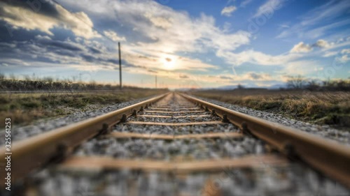4K Forwarding low angle train rail perspective in motion - landscape travel and transport background photo