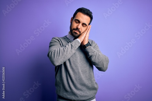 Cuadro en lienzo Handsome businessman with beard wearing casual tie standing over purple background sleeping tired dreaming and posing with hands together while smiling with closed eyes