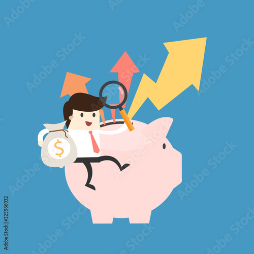 Businessman sit on piggy bank with a pile of coins,investment concept