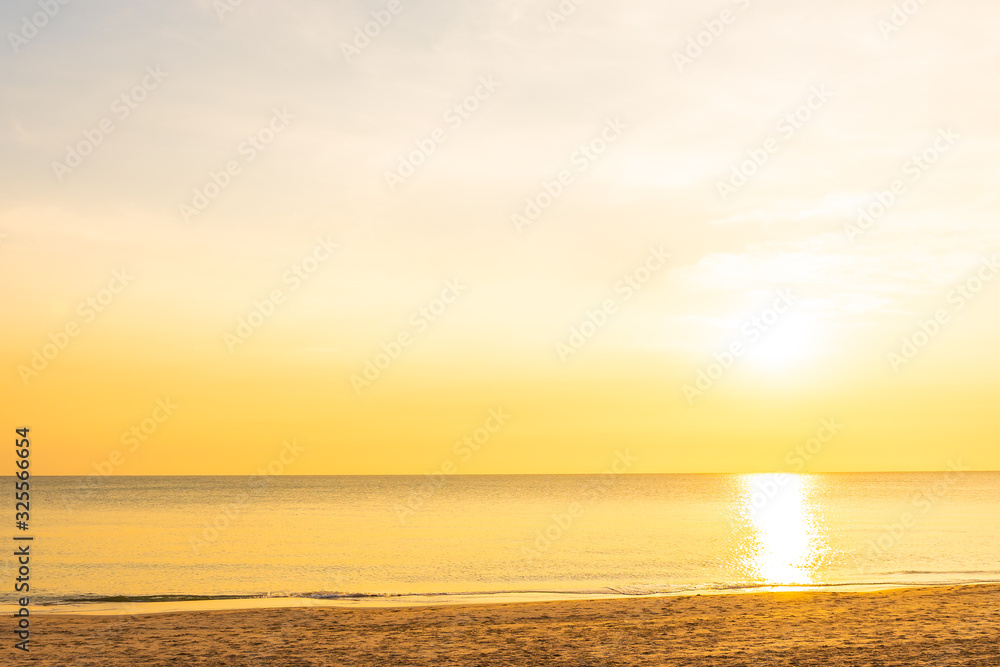 Beautiful tropical nature beach sea ocean at sunset or sunrise Beautiful tropical nature beach sea ocean at sunset or sunrise