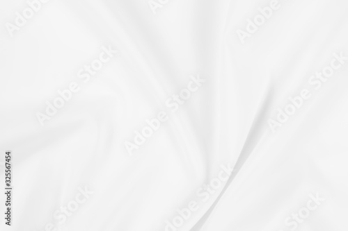 Abstract white fabric texture background. Cloth soft wave. Creases of satin, silk, and cotton. 