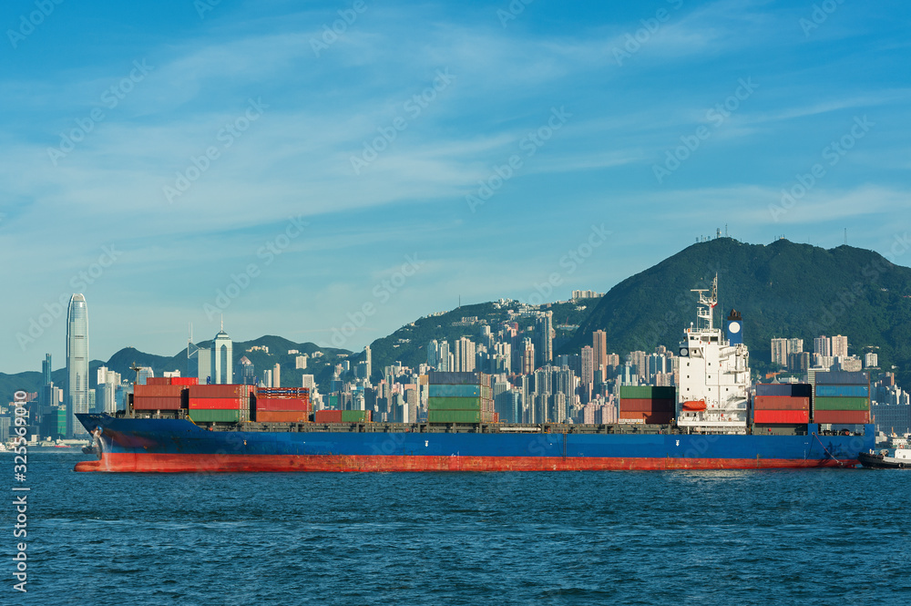 Cargo ship in Victoria Harbor of Hong Kong