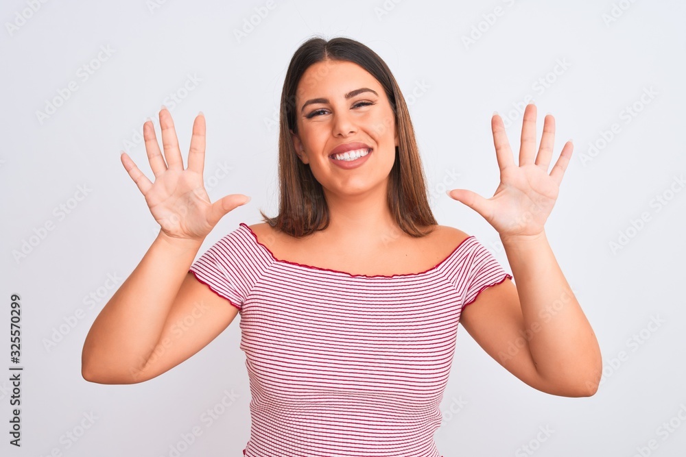 Portrait of beautiful young woman standing over isolated white background showing and pointing up with fingers number ten while smiling confident and happy. Portrait of beautiful young woman standing over isolated white background showing and pointing up with fingers number ten while smiling confident and happy.