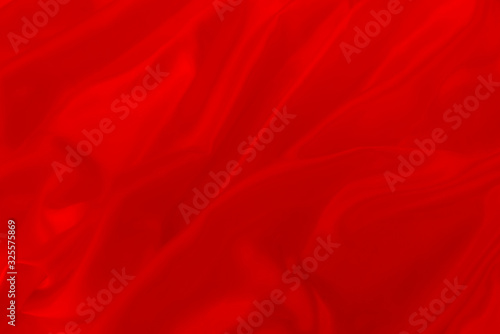 abstract background or texture of rippled red silk fabric lines