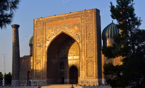 Ornate facade of an historic madrassa in Samarkand at sunset