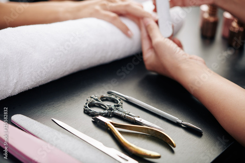 Close-up image of tools on table of professional manicurist