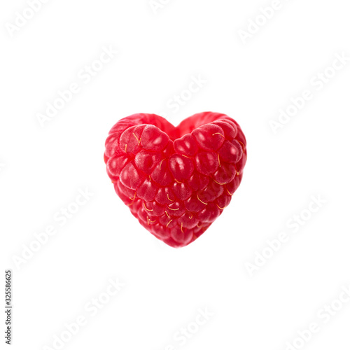 Raspberry in the shape of a heart on a white background