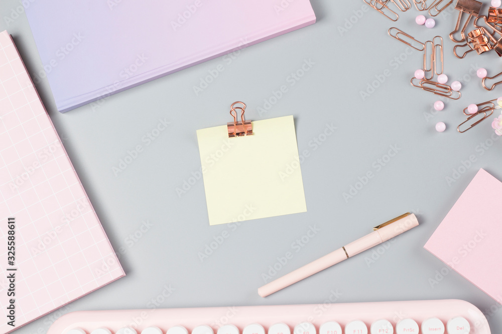 flat lay stationery on work desk in gray pastel background flat lay stationery on work desk in gray pastel background