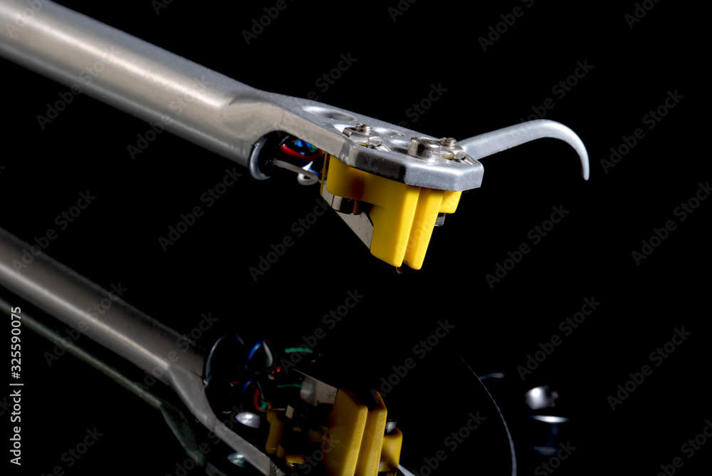 Turntable arm closeup on black background Turntable arm closeup on black background