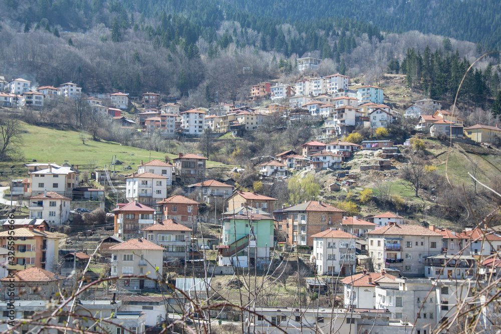 March 25, 2019 - Smolyan city, Bulgaria, houses on the hill of the mountain, rural scene