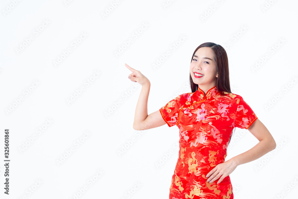 Chinese woman wearing Cheongsam red dress. Women pointing to the white space. Chinese woman wearing Cheongsam red dress. Women pointing to the white space.