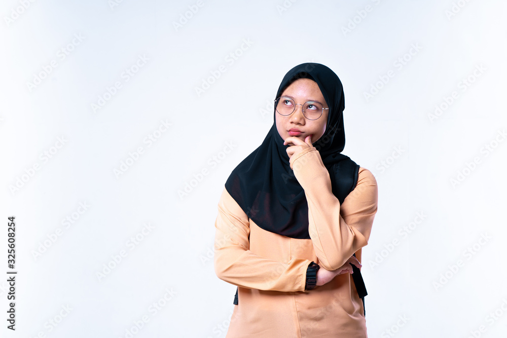 A young women thinking over an idea. Attractive thinking teenager, student. On a white background. A young women thinking over an idea. Attractive thinking teenager, student. On a white background.