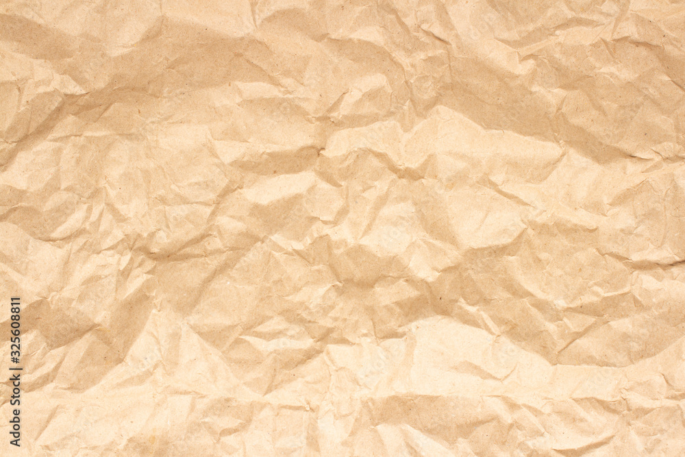 Obraz premium Crumpled brown craft paper. Texture, banner. Can be used as background. Top view, flat lay