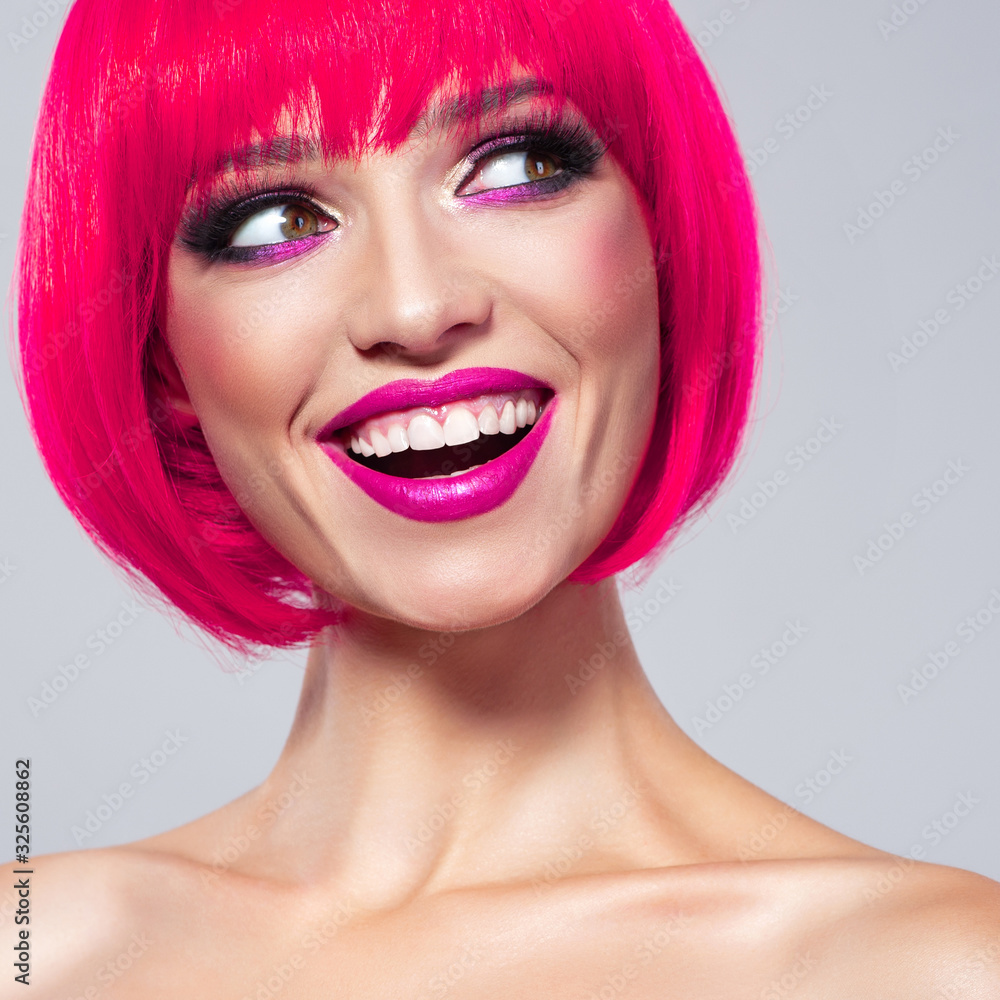 Fun fashion model with bright make-up. Laughing Model with creative colored  bob hairstyle. Stock Photo | Adobe Stock