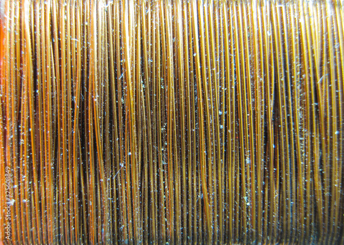 Background of copper wire wound on a coil. A close-up shot of the wire.