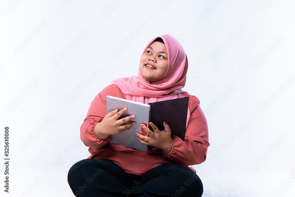 Pensive female student isolated over a white background Pensive female student isolated over a white background