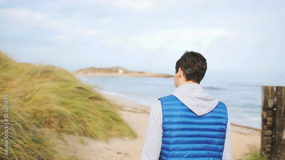 Photographer watching to the sea looks like model Photographer watching to the sea looks like model