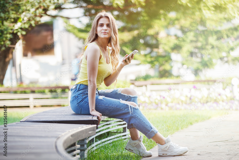 Girl, smartphone, summer, park in city. Girl, smartphone, summer, park in city.